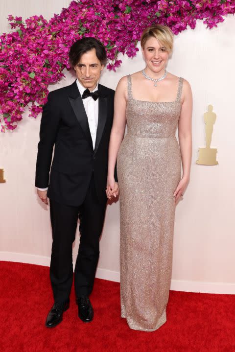 HOLLYWOOD, CALIFORNIA – MARCH 10: (L-R) Noah Baumbach and Greta Gerwig attend the 96th Annual Academy Awards on March 10, 2024 in Hollywood, California. (Photo by Marleen Moise/Getty Images)
