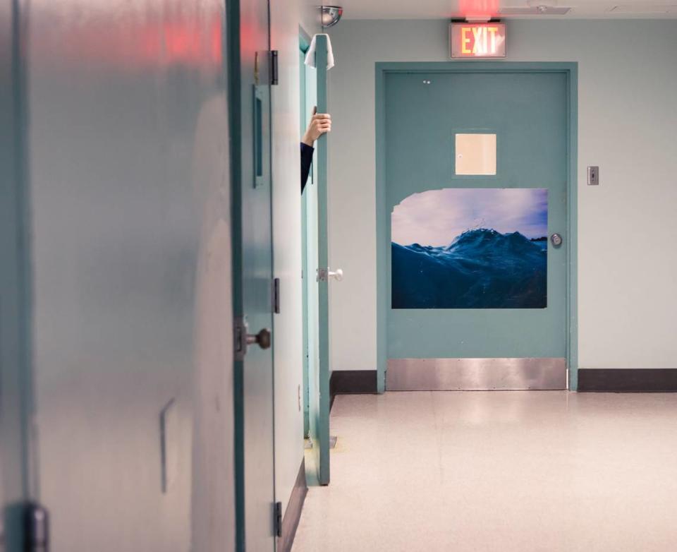 A patient closes their door in the 16-bed adult wing of Psychiatric Health Facility in San Luis Obispo. The grand jury called the facility “antiquated and unsafe.”
