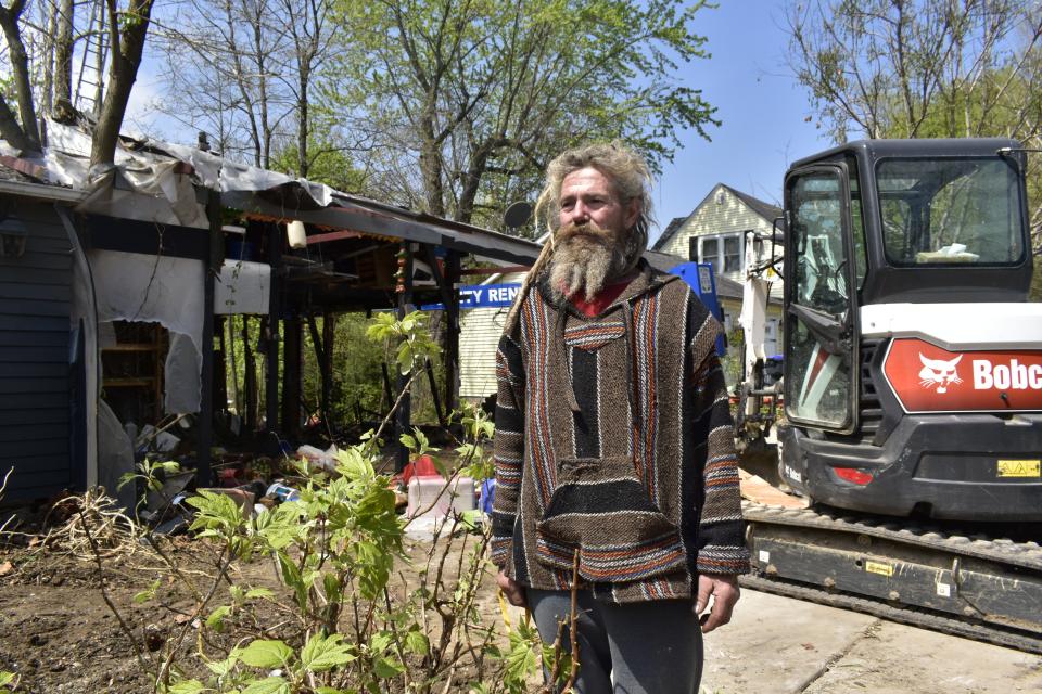 Robert Lowers outside his Ellettsville home on April 27 when town workers came to clear away structures he had added to his house and property in violation of town ordinances.