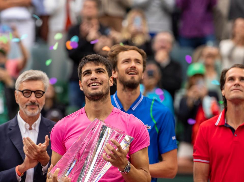 Carlos Alcaraz of Spain holds the trophy after defeating Daniil Medvedev of Russia in the men's singles final at the BNP Paribas Open of the Indian Wells Tennis Garden in Indian Wells, Calif., Sunday, March 19, 2023. 