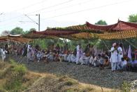 Farmers block train tracks during a protest following the recent passing of agriculture bills in the Lok Sabha (lower house), at Devi Dasspura village some 25 kms from Amritsar on September 24, 2020. (Photo by NARINDER NANU/AFP via Getty Images)