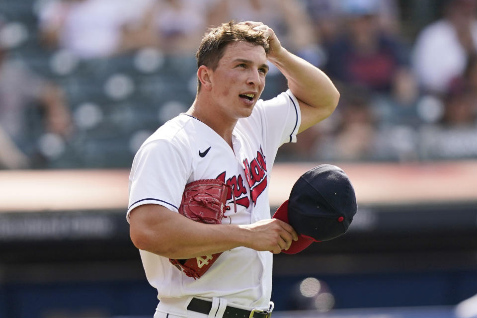 Cleveland Indians relief pitcher James Karinchak reacts after giving up a three-run home run to Minnesota Twins' Kyle Garlick in the tenth inning of a baseball game, Sunday, May 23, 2021, in Cleveland. (AP Photo/Tony Dejak)