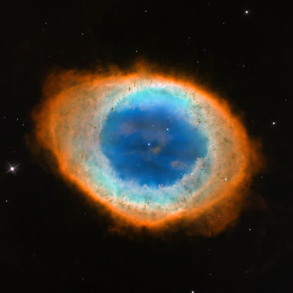 This close-up, visible-light view by NASA's Hubble Space Telescope reveals new details of the Ring Nebula. The object is tilted toward Earth so that astronomers see the ring face-on. The Hubble observations reveal that the nebula's shape is mo