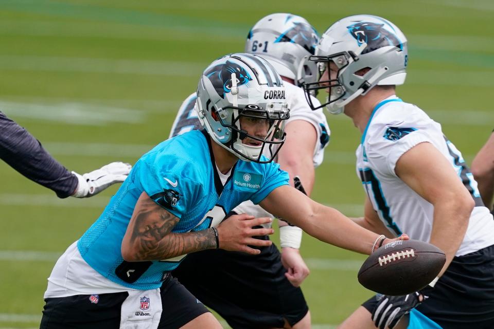 Matt Corral fakes a handoff during the Panthers' rookie minicamp on Friday in Charlotte, N.C.