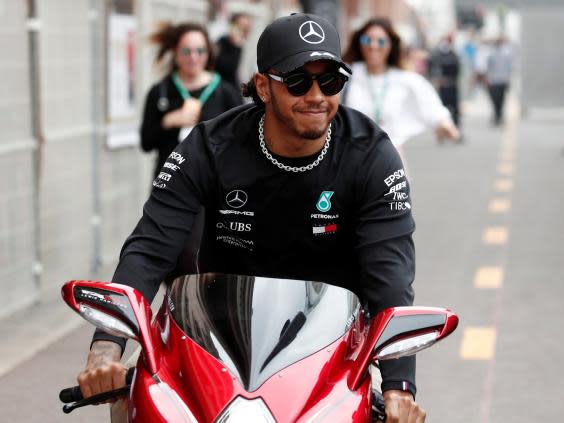 Hamilton arrived in Monaco on his MV Augusta motorbike (Reuters)