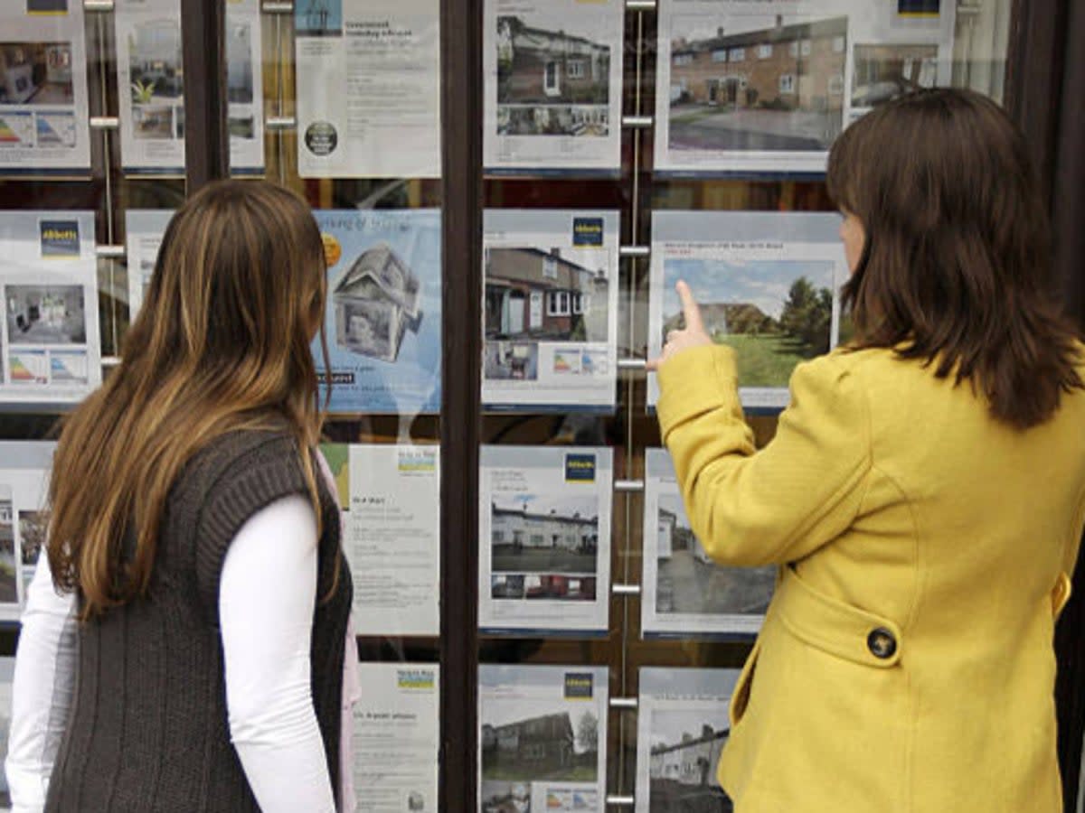 File photo: Two women look at houses for sale  (AFP via Getty Images)