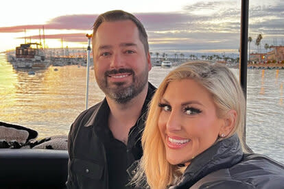 Travis Mullen and Gina Kirschenheiter pose for a photo together.