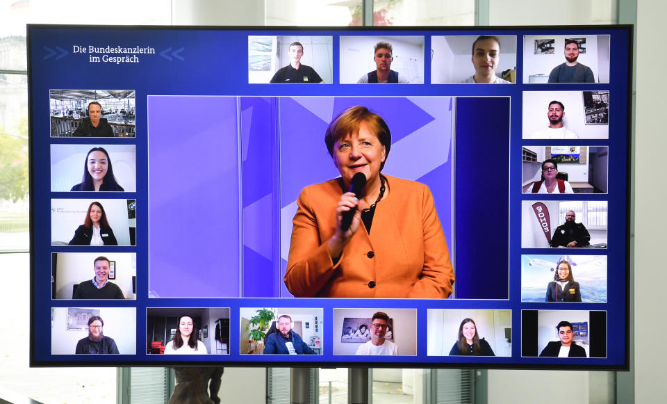 German chancellor Angela Merkel takes part in a 'Citizen Dialogue' with young job trainees on 12 November. Photo: John Macdougall/Getty Images
