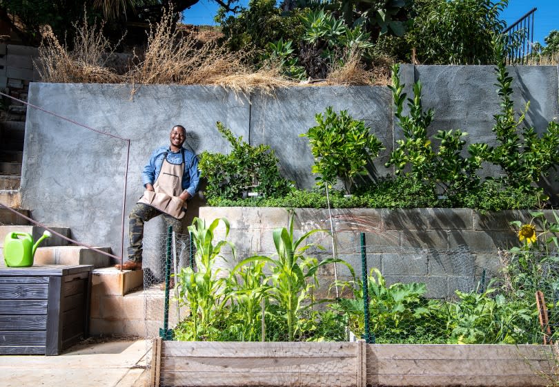 LOS ANGELES, CA - JUNE 30: Portrait of Ken Sparks at his home garden in East Los Angeles on Tuesday, June 30, 2020 in Los Angeles, CA. Growing an array of fruits and vegetables, Sparks has taken a concrete canvas and begun to turn it into something alive and soft. (Mariah Tauger / Los Angeles Times)