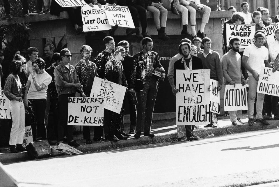 FILE - Students from the University of the Witwatersrand protest in Johannesburg, South Africa, Aug. 20, 1968. South Africa is engrossed in debate over the legacy of apartheid's last president, F.W. de Klerk, who died at 85 and is to be buried Sunday, Nov 21, 2021. Some people want to remember de Klerk as the liberator of Nelson Mandela, but others say he was responsible for racist murders. (AP Photo/File)