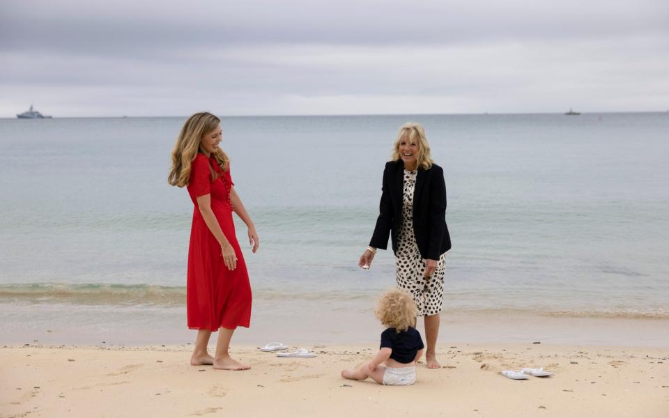 Dr Jill Biden smiles with Carrie Johnson and her son Wilfred on the beach during the G7 leaders Summit in Carbis Bay Cornwall - No10 Downing Street 