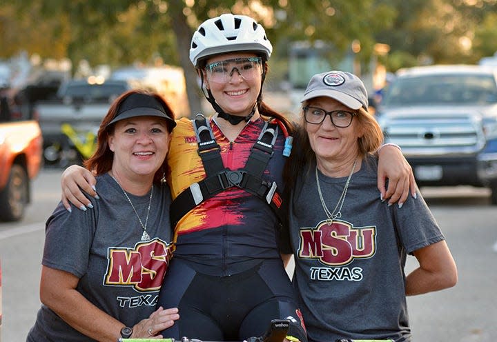 Jacelyn Reno, center, with her mother Linda Reno, left, and supporter Maria Concha, right, at the Hotter N' Hell Hundred race in Wichita Falls.