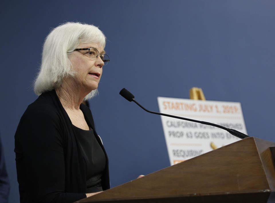 Amanda Wilcox, spokeswoman for the Brady Campaign to Prevent Gun Violence, discusses a 2016 voter-approved ballot initiative that will require Californians to undergo criminal background checks every time they buy ammunition starting July 1 during a news conference in Sacramento, Calif., Tuesday, June 25, 2019. Wilcox said the checks required by the new law are "the kind of thing that could have prevented the shooting last week" of rookie Sacramento police Officer Tara O'Sullivan. (AP Photo/Rich Pedroncelli)