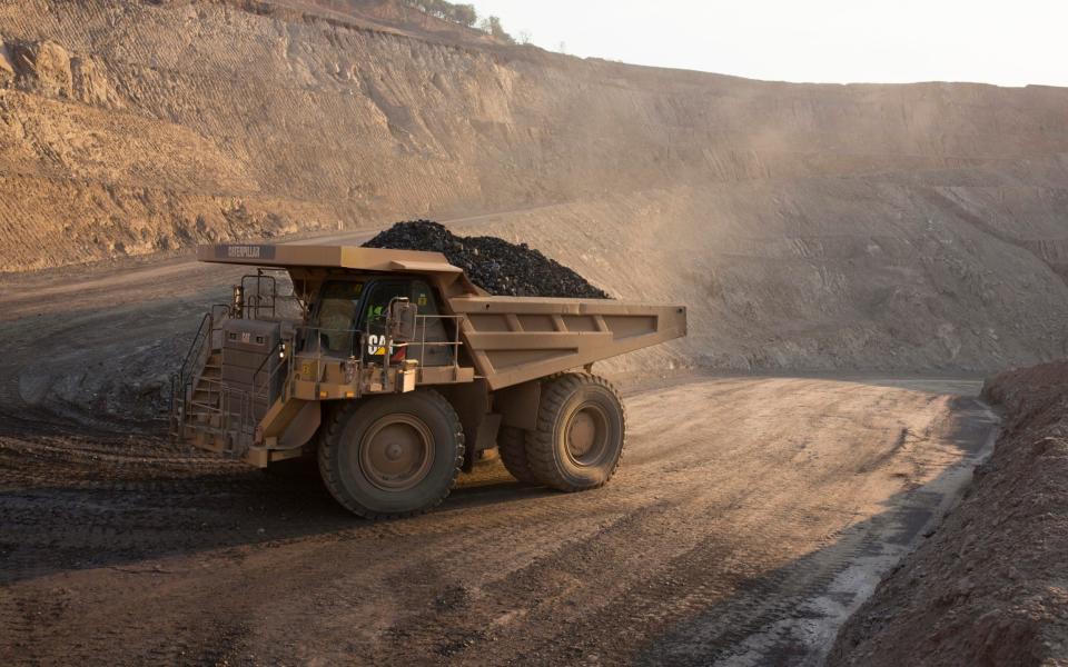 The sun sets on one of the open pit copper mines at Mutanda Mining Sarl on July 6, 2016 in Kolwezi, DRC. The mine is owned (69%) by Glencore, an Anglo-Swiss multinational commodity trading and mining company - Per-Anders Pettersson/Getty Images