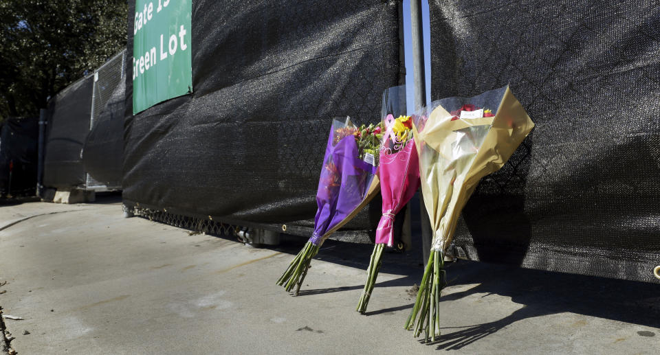 Flowers lie against the south fence surrounding the Astroworld festival grounds the day after several people died and scores were injured during a concert by rapper Travis Scott at the two-day event, held at NRG Park Saturday, Nov. 6, 2021, in Houston. Source: AP