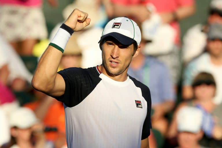 Dusan Lajovic of Serbia celrbsates match point against Vasek Pospisil of Canada during their BNP Paribas Open third round match, at the Indian Wells Tennis Garden in California, on March 13, 2017