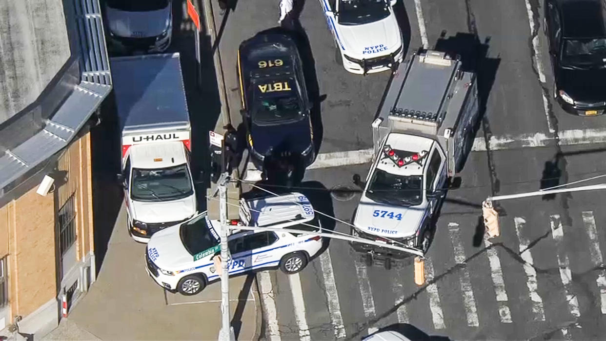 Police surround a U-Haul truck used in suspected hit-and-run in New York on Feb. 13, 2023. (NBC New York)