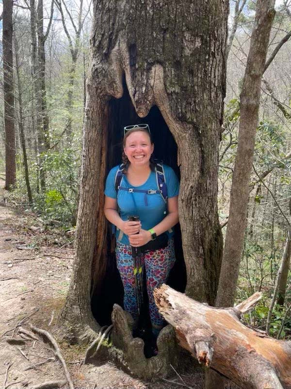 Great Smoky Mountains hiker Ashley Walker takes a break to nestle in a tree, saying “There are so many great sites in the GSMNP.” April 7, 2022.