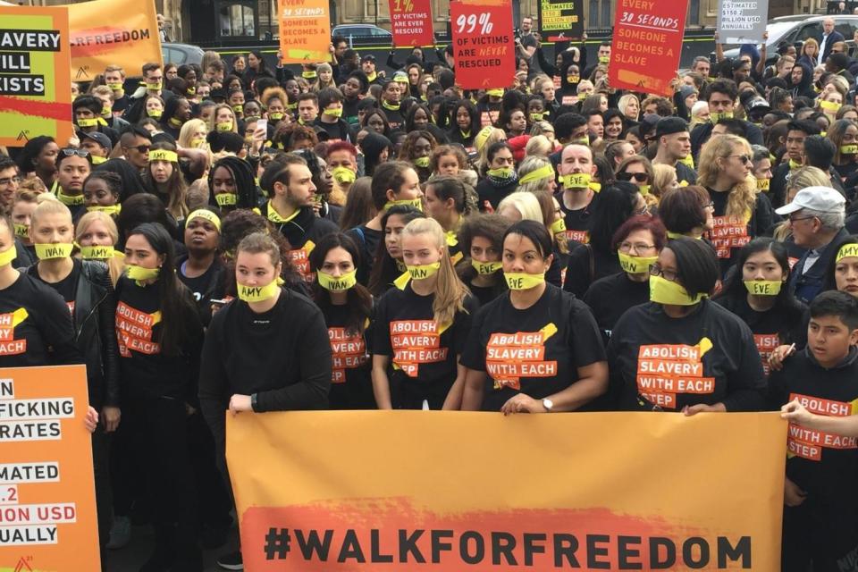 Protesters march to highlight the issue of modern slavery