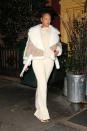 <p>In a cropped Burberry shearling coat, cream sweater, matching flared pants, gold velvet pumps and hoop earrings while out in New York. </p>