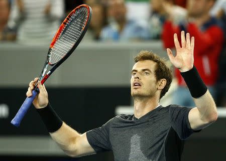 Britain's Andy Murray celebrates after winning his third round match against Portugal's Joao Sousa at the Australian Open tennis tournament at Melbourne Park, Australia, January 23, 2016. REUTERS/Thomas Peter