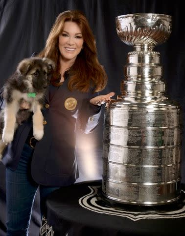 <p>Chris Ameruoso/NHL Images</p> Lisa Vanderpump with the real Stanley Cup, and a pup