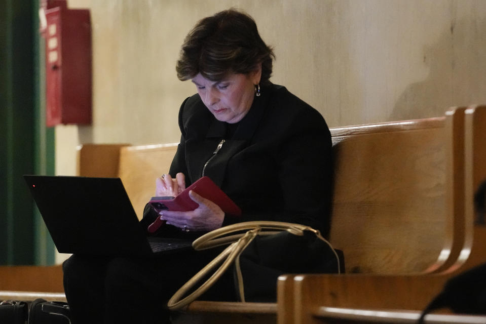 Attorney Gloria Allred works on her laptop outside a Manhattan criminal courtroom, Wednesday, May 1, 2024, in New York. Harvey Weinstein is due back in a New York courtroom for the first time since his 2020 rape conviction was overturned by an appeals court last week. (AP Photo/Mary Altaffer)