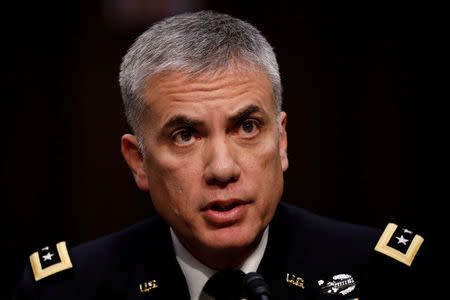 FILE PHOTO - Lieutenant General Paul Nakasone, nominee to lead the National Security Agency and US Cyber Command, testifies before the Senate Intelligence Committee on Capitol Hill in Washington, U.S., March 15, 2018. REUTERS/Aaron P. Bernstein/File Photo