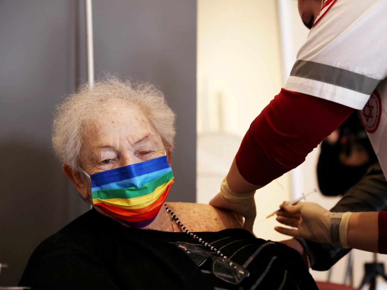 A woman receives a COVID-19 booster shot Netanya, Israel, January 19, 2021.