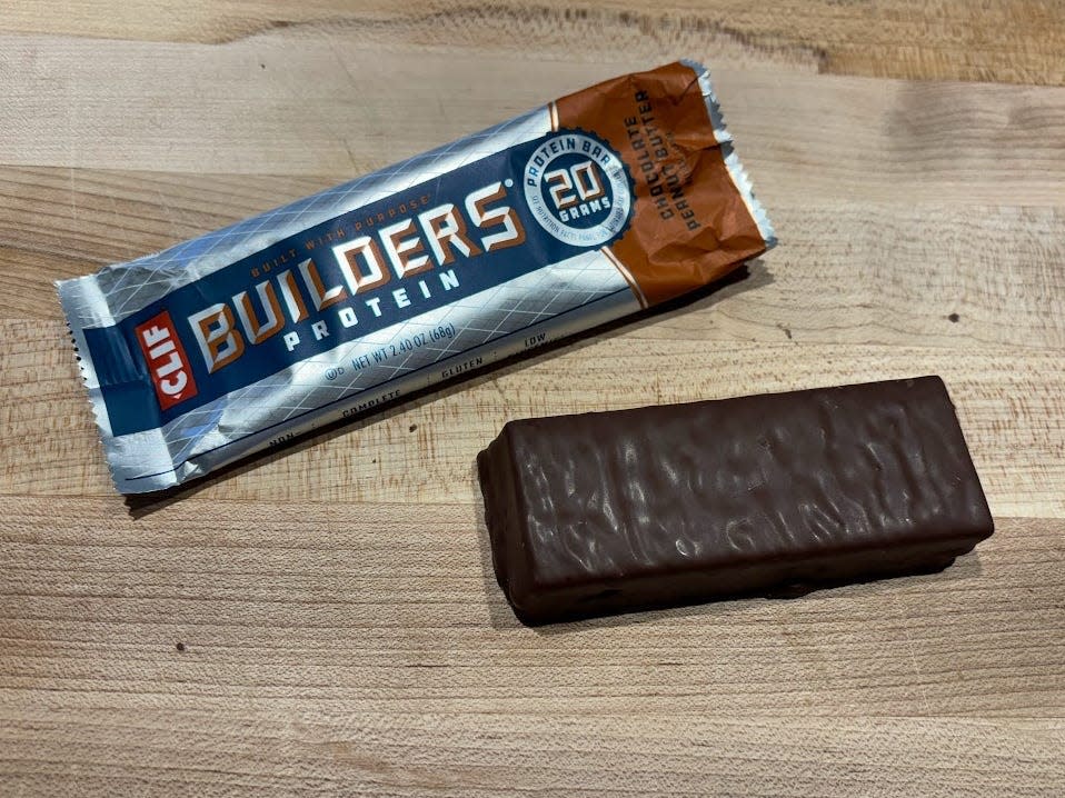 Clif Builders protein bar wrapper with unwrapped bar next to it 