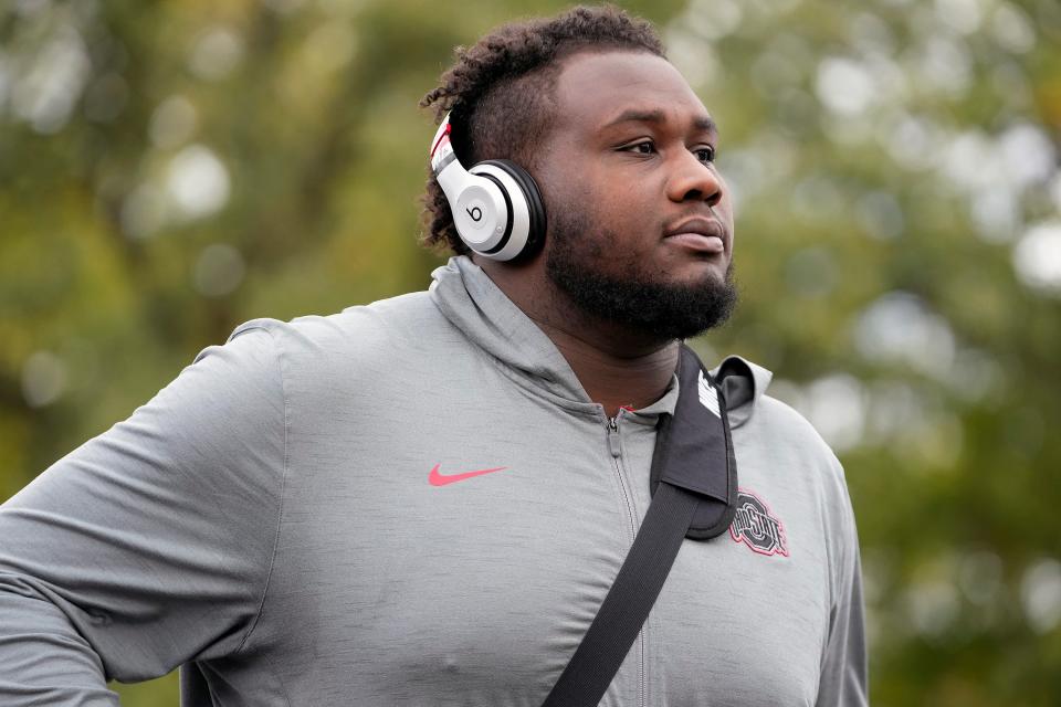 Ohio State offensive lineman Dawand Jones (79) arrives at the stadium before a game against Michigan State in East Lansing, Mich.