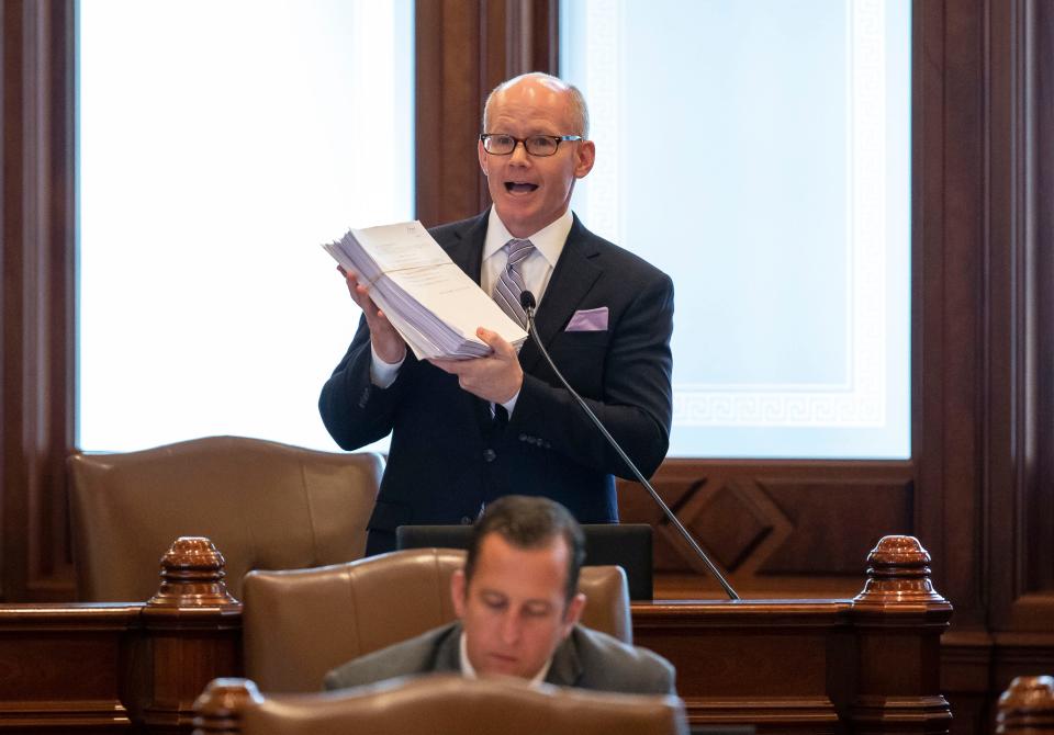 Illinois Senate President Don Harmon, D-Oak Park, holds up Senate Bill 2048, a comprehensive energy proposal, to note how much work was done on the bill as he gives his closing remarks on the floor of the Illinois Senate at the Illinois State Capitol in Springfield, Ill., Monday, September 13, 2021. [Justin L. Fowler/The State Journal-Register] 