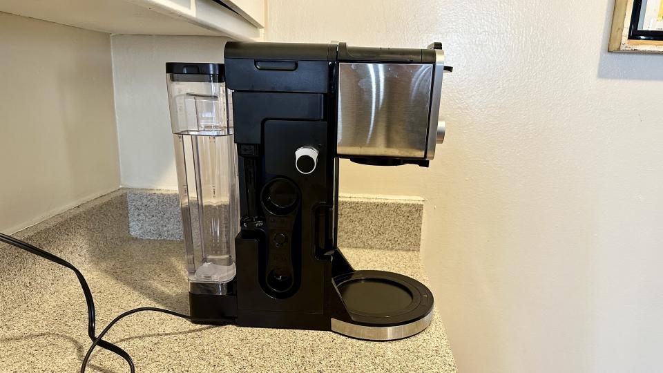 Coffee maker with water tank installed in the back