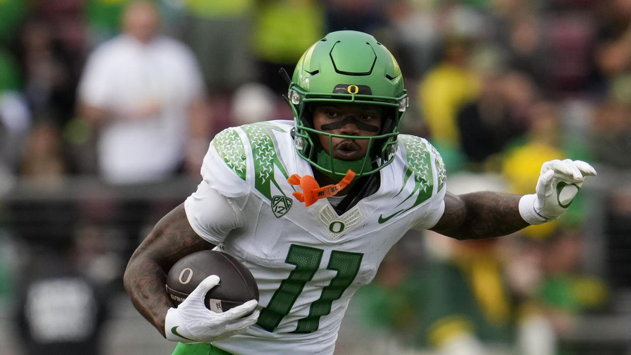 Oregon wide receiver Troy Franklin runs with the ball during the first half of an NCAA college football game against Stanford on Saturday, Sept. 30, 2023, in Stanford, Calif. (AP Photo/Godofredo A. Vásquez)