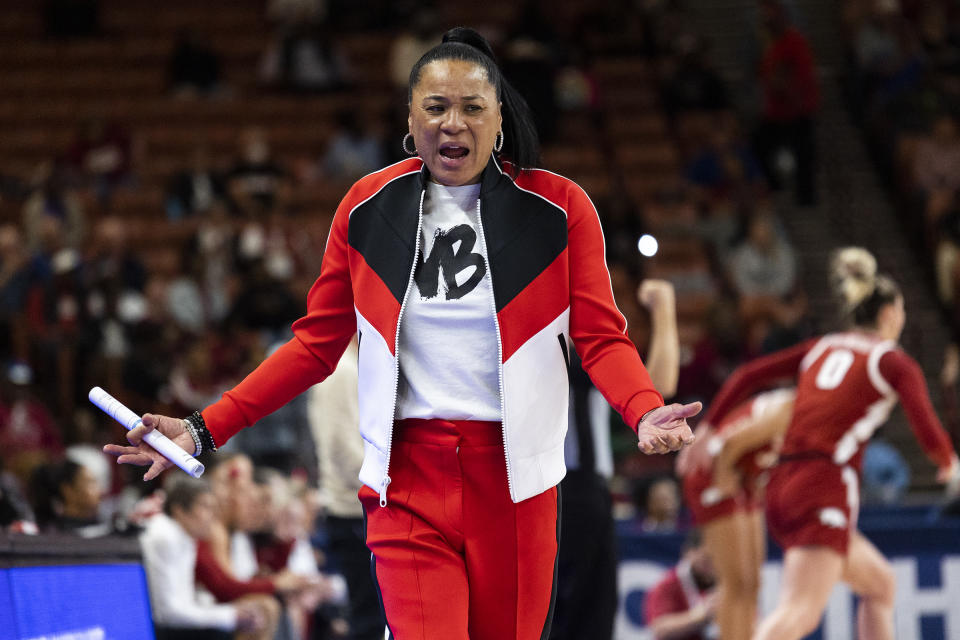 South Carolina's head coach Dawn Staley questions an officials call in the second half of an NCAA college basketball game against Arkansas during the Southeastern Conference women's tournament in Greenville, S.C., Friday, March 3, 2023. (AP Photo/Mic Smith)