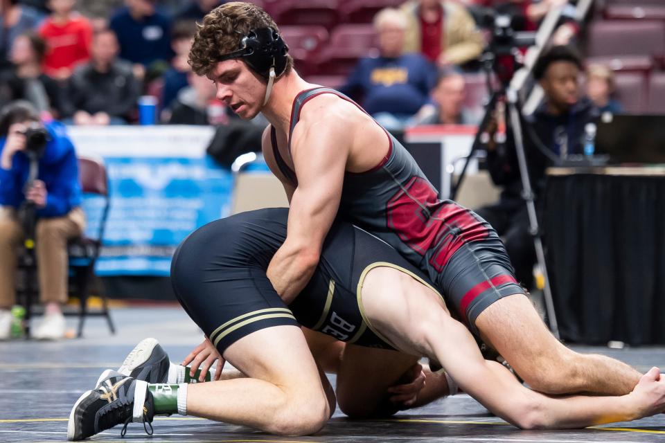 Shippensburg's Dominic Frontino (top) wrestles Bethlehem Catholic's Andrew Harmon in the 160-pound third-place bout at the PIAA Class 3A Wrestling Championships at the Giant Center on March 11, 2023, in Hershey. Harmon won by decision, 3-0.