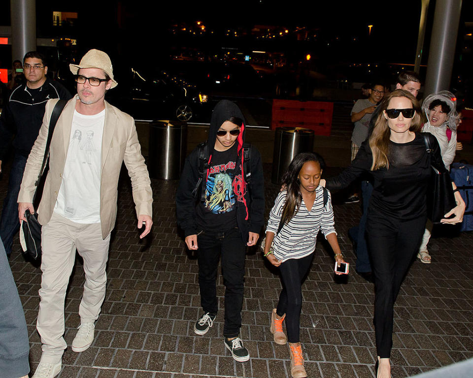 Brad Pitt, Maddox Jolie-Pitt, Zahara Jolie-Pitt and Angelina Jolie are seen at LAX on June 06, 2014 in Los Angeles, California