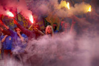 <p>Volunteers of the Azov Civil Corps light flares during rally at the Ukrainian Parliament, May 20, 2016, against holding local elections in the occupied eastern territories of Ukraine. As part of an internationally brokered peace agreement, Ukraine must hold local elections in two eastern regions controlled by Russian-backed rebels, but there are major concerns about ensuring the vote takes place in a secure and safe atmosphere. (Efrem Lukatsky/AP) </p>