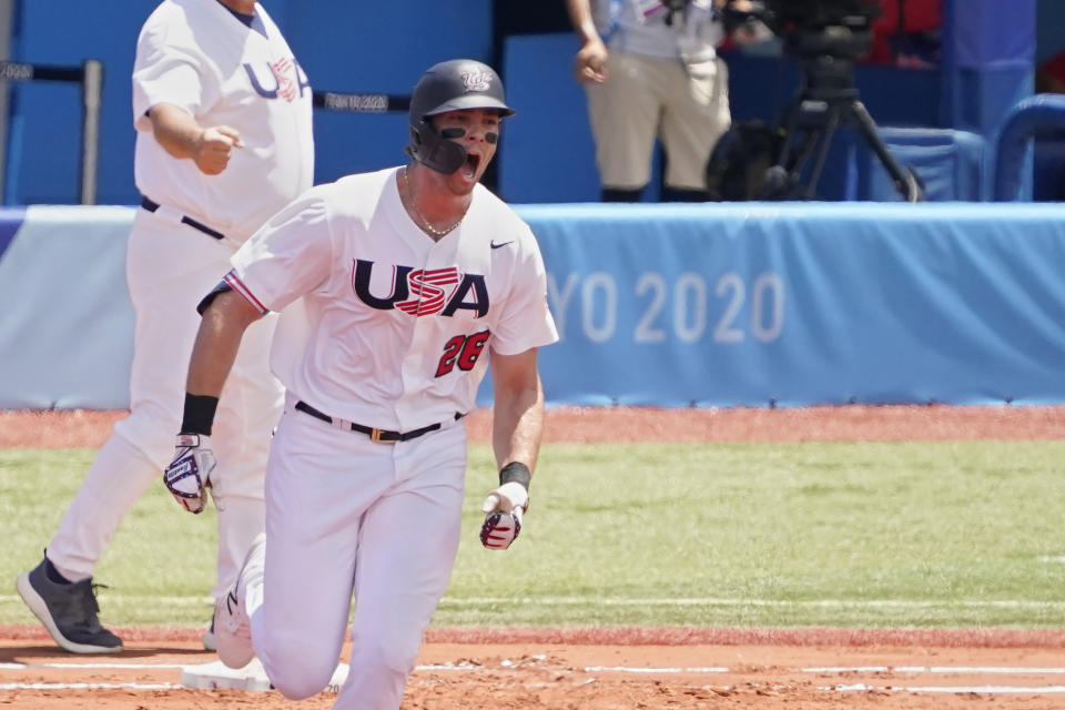 United States' Triston Casas (26) shouts as he rounds first base after hitting a home run in the first inning of a baseball game against the Dominican Republic at the 2020 Summer Olympics, Wednesday, Aug. 4, 2021, in Yokohama, Japan. (AP Photo/Sue Ogrocki)