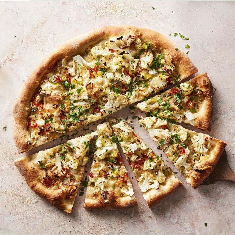 <p>It can be hard to get the kids to eat veggies, but they'll happily gobble them down once you incorporate them into this pizza. This roasted cauliflower and red chile pizza is a real crowd-pleaser come dinner time.</p><p><em><a href="https://www.womansday.com/food-recipes/a32676748/roasted-cauliflower-and-red-chile-pizza-recipe/" rel="nofollow noopener" target="_blank" data-ylk="slk:Get the Roasted Cauliflower and Red Chile Pizza recipe.;elm:context_link;itc:0;sec:content-canvas" class="link ">Get the Roasted Cauliflower and Red Chile Pizza recipe. </a></em></p>