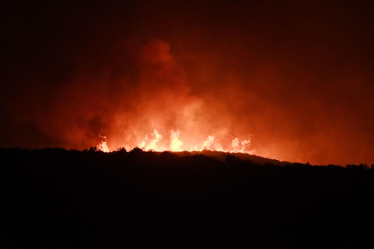 Smoke billows from a wildfire near the city of Volos, central Greece, on July 26 (AFP via Getty Images)