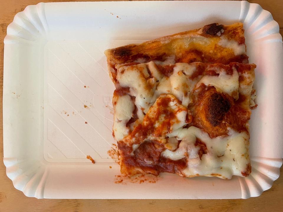 slice of square roman style pizza on a plate in rome, italy