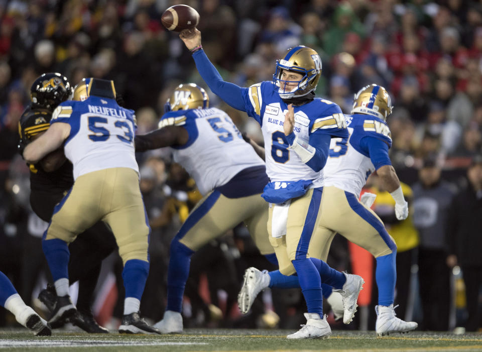 Winnipeg Blue Bombers quarterback Zach Collaros (8) throws during first-half football game action against the Hamilton Tiger-Cats in the Grey Cup in Calgary, Alberta, Sunday, Nov. 24, 2019. (Nathan Denette/The Canadian Press via AP)