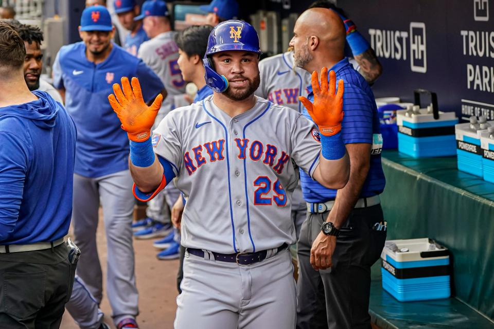 Aug 21, 2023; Cumberland, Georgia, USA; New York Mets right fielder DJ Stewart (29) reacts in the dugout after hitting a home run against the Atlanta Braves during the second inning at Truist Park. Mandatory Credit: Dale Zanine-USA TODAY Sports