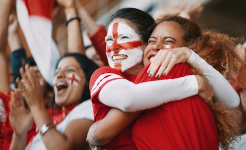 <span class="attribution"><a class="link " href="https://www.shutterstock.com/image-photo/female-soccer-fans-england-hugging-celebrating-1988590760" rel="nofollow noopener" target="_blank" data-ylk="slk:Jacob Lund/Shutterstock;elm:context_link;itc:0;sec:content-canvas">Jacob Lund/Shutterstock</a></span>