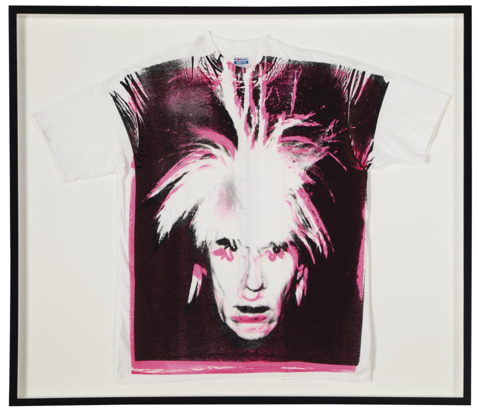 This undated photo provided by Christies's auction house in New York shows Andy Warhol's "Self-Portrait with Fright Wig screenprint on t-shirt," with a pre-auction estimate of $15,000 - $20,000. It is one of about 125 artworks being offered from Feb. 26 through March 5 in Christie's first online-only Warhol sale. The works can be previewed online prior to the sale. Bidders can browse, bid and receive instant updates by email or phone if another bid exceeds theirs. (AP Photo/Christie's)