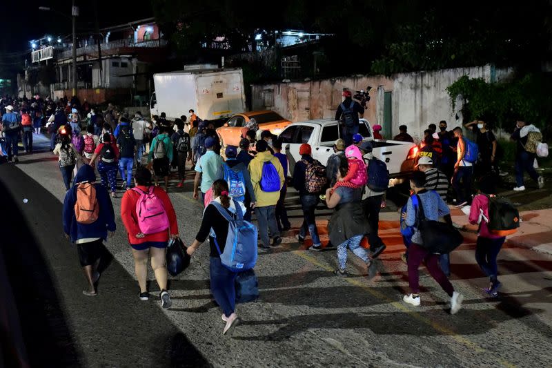 Hondurans take part in a new caravan of migrants, set to head to the United States, in San Pedro Sula