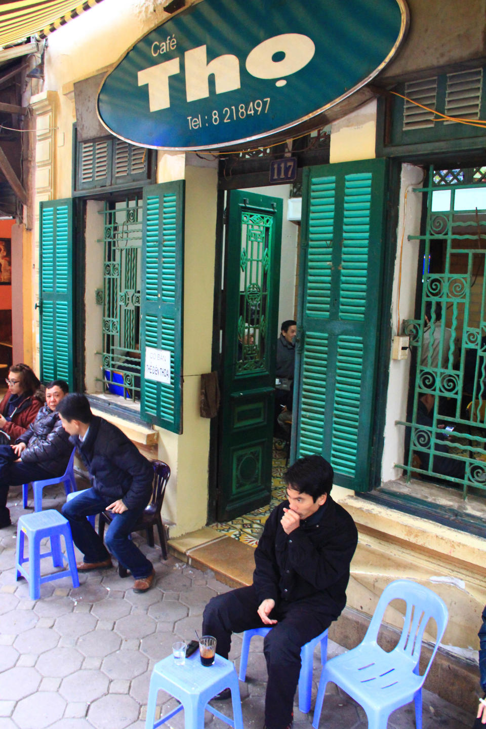 A customer drinks coffee at Cafe Tho in downtown Hanoi, Vietnam, Saturday, Jan. 5, 2013. Starbucks announced Thursday, Jan. 3, it would enter Vietnam in early February with a cafe in Ho Chi Minh City. But the Seattle-based company faces a unique market in Vietnam, where French-inspired coffee culture reigns supreme; two homegrown chains have established presences; and family-run sidewalk cafes are as ubiquitous as noodle shops. (AP photo /Mike Ives)