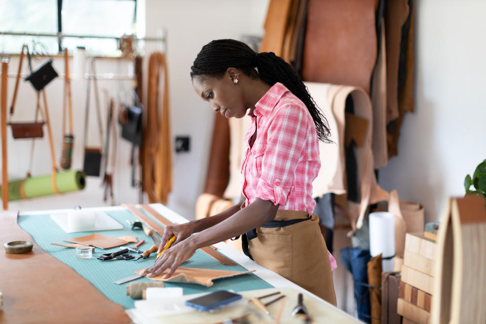 A woman is working in her workshop