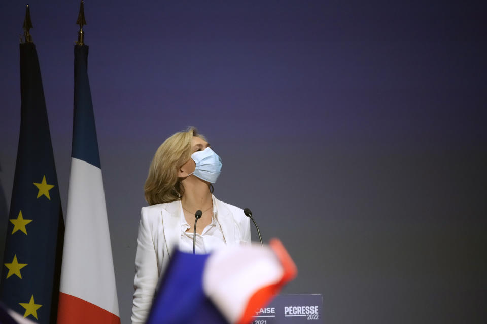 Valerie Pecresse, candidate for the French presidential election 2022, arrives to deliver a speech during a meeting in Paris, France, Saturday, Dec. 11, 2021. The first round of the 2022 French presidential election will be held on April 10, 2022 and the second round on April 24, 2022. (AP Photo/Christophe Ena)